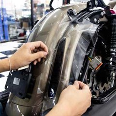 Motorcycle paint being protected by protective film