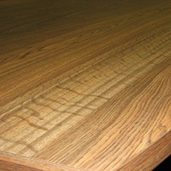 Laminated office table with wood texture design.
