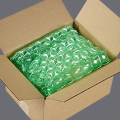 El acolchado protector verde HC Renew se emplea dentro de una caja.